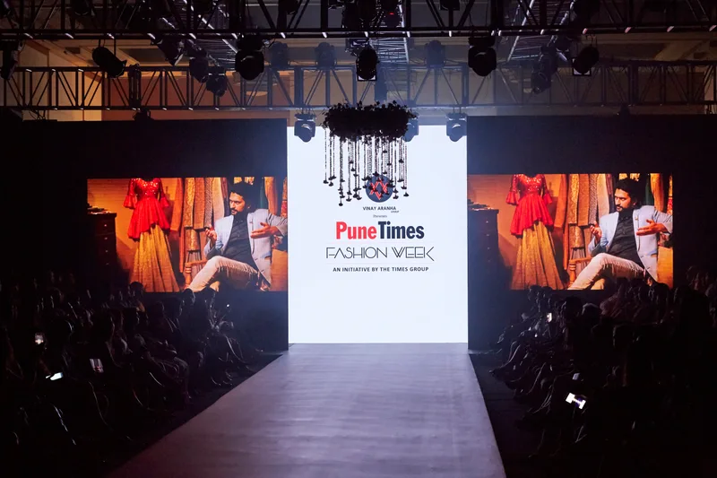 Wide view of the runway stage and seated audience